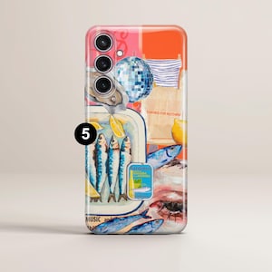 May include: A phone case with a vibrant, artistic design. The design includes sardines, lemons, a disco ball, and the text "THANKS FOR NOTHING". The case has a glossy finish and a camera cutout.