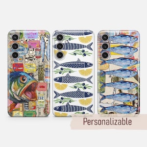May include: Three phone cases with different designs. One case has a colourful fish and vintage labels. Another shows navy fish, lemon slices, and olive branches. The third displays blue fish illustrations. The word "Personalizable" is at the bottom.
