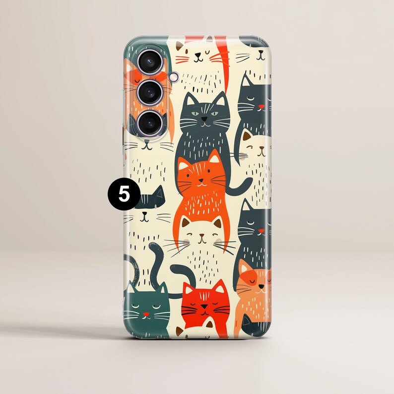 May include: A phone case with a white background and a repeating pattern of colorful cats. The cats are in various poses and have different expressions. The case has a camera cutout and a black border.