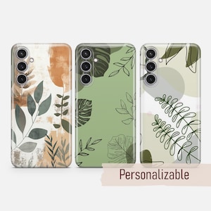 Könnte beinhalten: Drei Handyhüllen mit verschiedenen Designs, die abstrakte Formen und Blätter in Grün-, Braun- und Weißtönen zeigen. Die Hüllen sind personalisierbar.