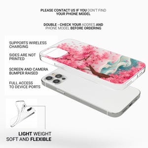 May include: A clear phone case with a pink cherry blossom design, featuring a tree and stylized waves. The case is shown on top of a silver phone. Text on the image includes "Supports Wireless Charging" and "Light Weight Soft and Flexible."