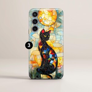May include: A black cat with colorful stained glass patterns sits in front of a yellow sun. The image is on a phone case.