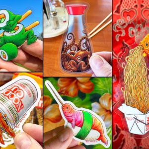 May include: A set of ten clear vinyl stickers featuring various food-themed illustrations. The stickers feature a crocodile eating sushi, a bottle of soy sauce with an octopus inside, a goldfish spitting out noodles, a hermit crab in a cup of ramen, and a narwhal wrapped in sushi.