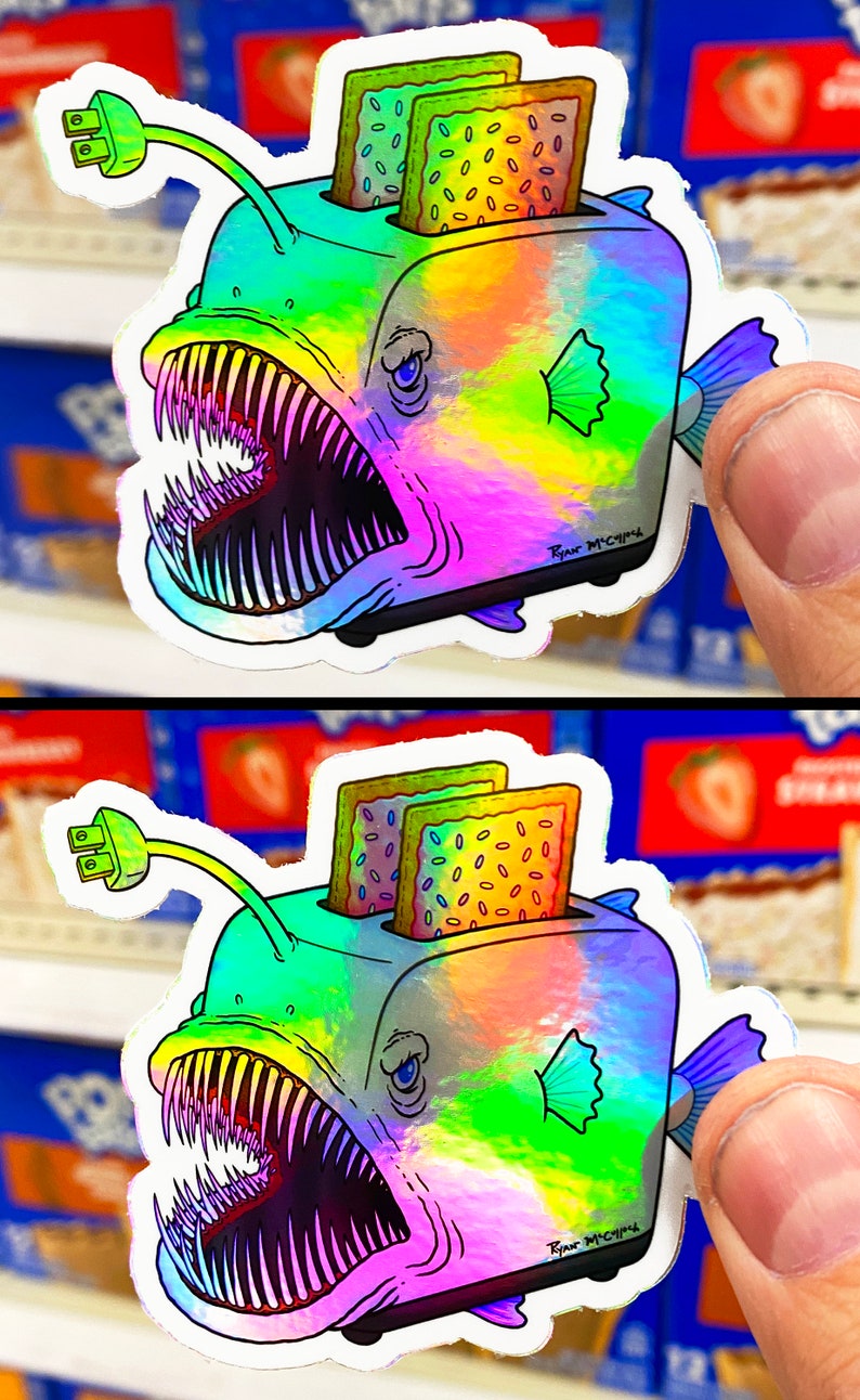 May include: A holographic sticker of a anglerfish with a toaster on its head. The toaster has two slices of toast with sprinkles inside. The sticker has the text "Ryan McCrips" on the bottom right corner.