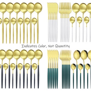 May include: A collection of gold-colored flatware sets, including forks, knives, and spoons. Some sets have white, navy, or teal handles. The text "Indicates Color, Not Quantity" is visible.