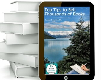 May include: A tablet computer displaying a book cover with the title "Top Tips to Sell Thousands of Books" by Laurel Downing Bill. The cover features a scenic landscape with a lake and a pine tree. The Author Solutions logo is visible in the bottom left corner.