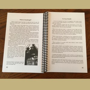 May include: A book with a white background and black text. The book is open to a page titled "What is Sourdough?" and a page titled "To Your Health." The page titled "What is Sourdough?" has a picture of two people in a tent. The page titled "To Your Health" has a list of health benefits of sourdough bread.