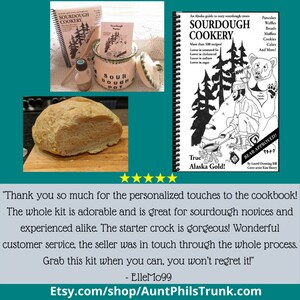May include: A sourdough starter kit with a ceramic crock, a cookbook titled "Sourdough Cookery: An Alaska Guide to Tasty Sourdough Treats", and a loaf of sourdough bread. The cookbook features a black and white illustration of a bear and a person cooking over a fire. The text "Bear Approved!" is printed on the cover.