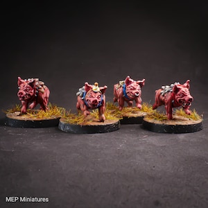 May include: Four miniature pig figures painted in shades of red, pink, and white. Each pig is wearing a blue and white harness and has a different expression on its face. The pigs are standing on round bases with a brown and green grass texture.
