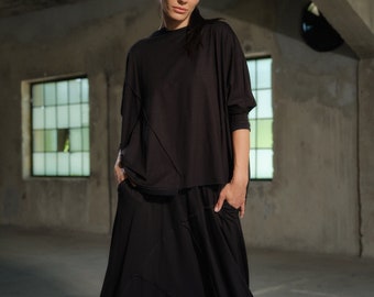 Avant-garde viscoseset – zwarte broek met laag kruis en asymmetrische top