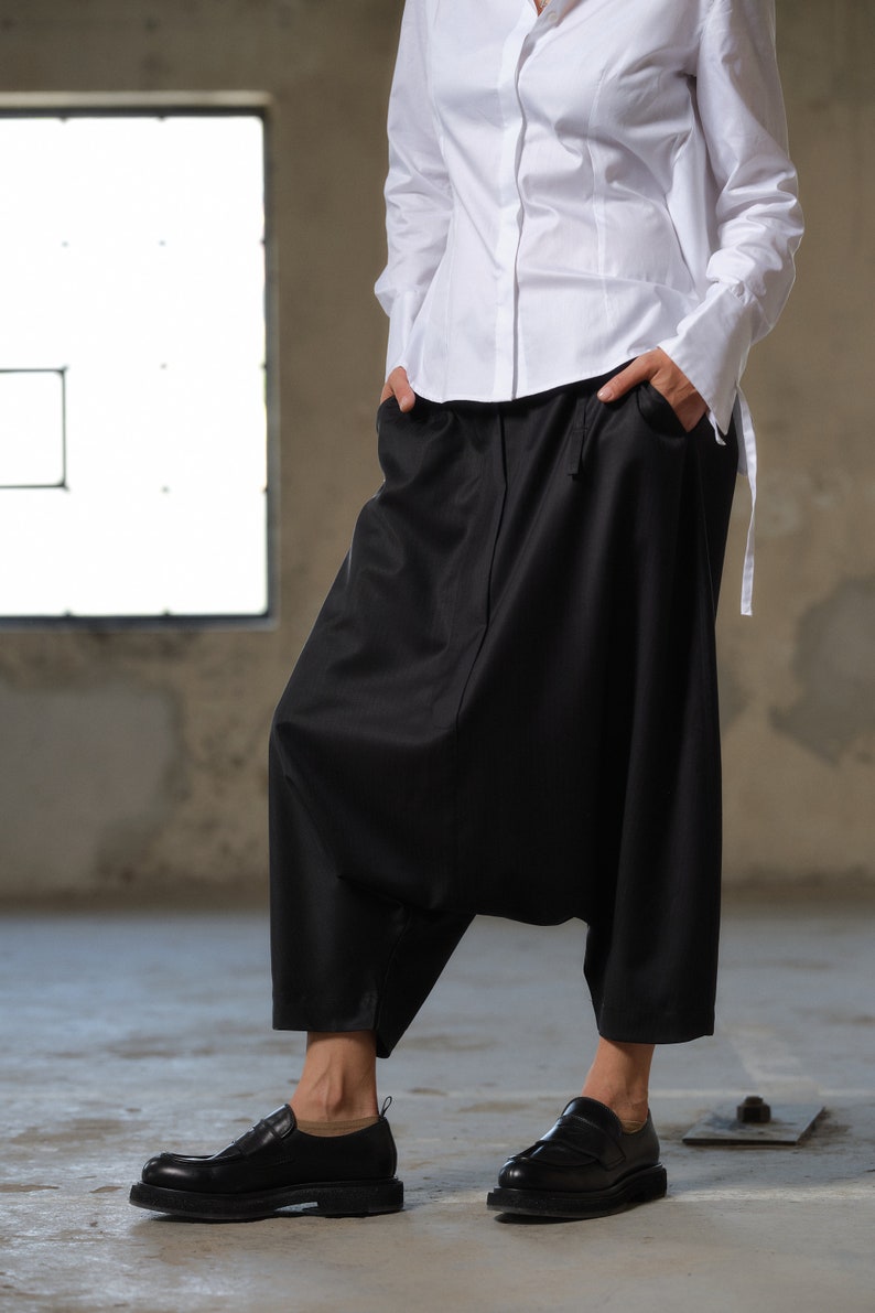 Black wool drop crotch pants with asymmetrical details, Avant-garde  pants Women, Baggy pants, Minimalist urban sustainable clothing