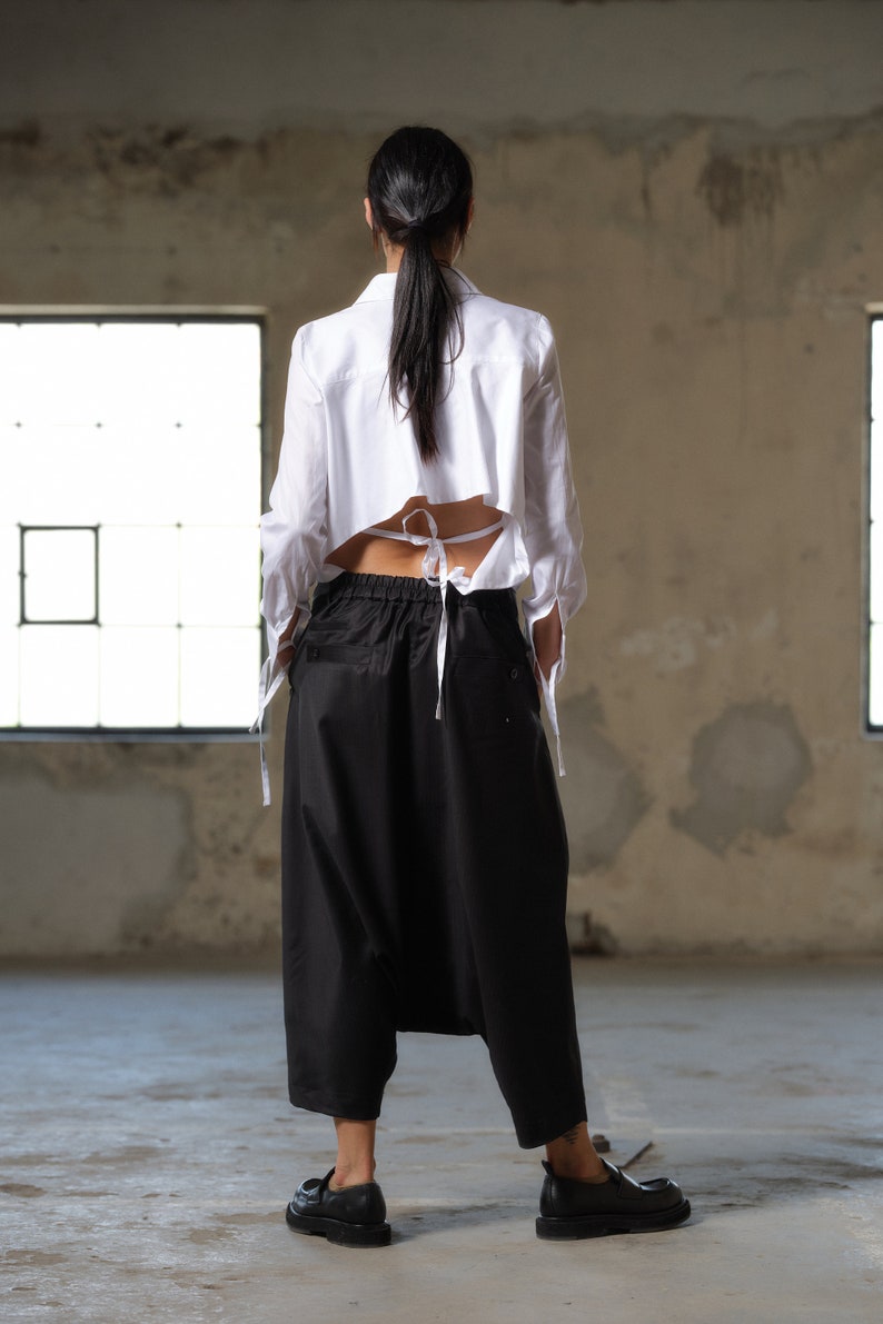 Black wool drop crotch pants with asymmetrical details, Avant-garde  pants Women, Baggy pants, Minimalist urban sustainable clothing