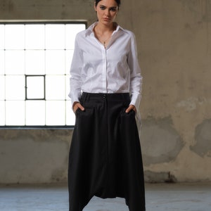 Black wool drop crotch pants with asymmetrical details, Avant-garde  pants Women, Baggy pants, Minimalist urban sustainable clothing