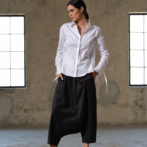 Black wool drop crotch pants with asymmetrical details, Avant-garde  pants Women, Baggy pants, Minimalist urban sustainable clothing