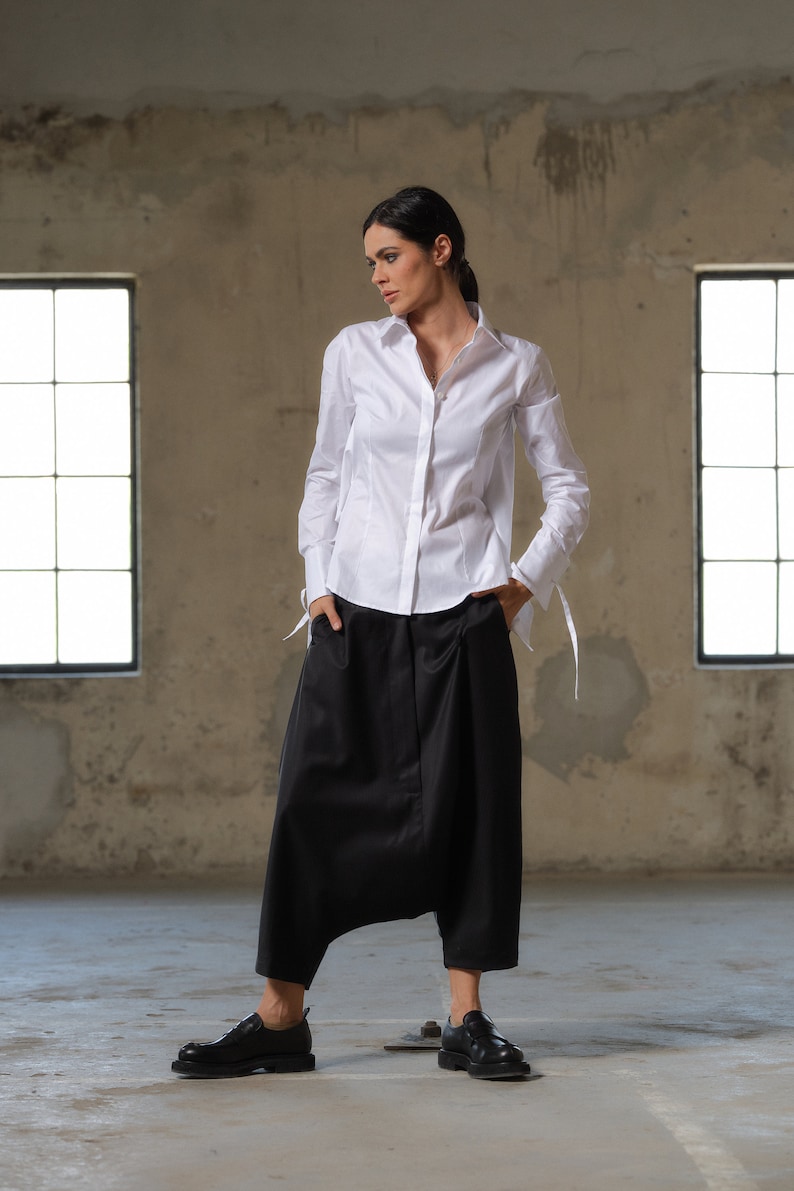 Black wool drop crotch pants with asymmetrical details, Avant-garde  pants Women, Baggy pants, Minimalist urban sustainable clothing