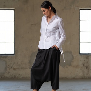 Black wool drop crotch pants with asymmetrical details, Avant-garde  pants Women, Baggy pants, Minimalist urban sustainable clothing