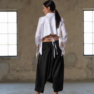 Black wool drop crotch pants with asymmetrical details, Avant-garde  pants Women, Baggy pants, Minimalist urban sustainable clothing