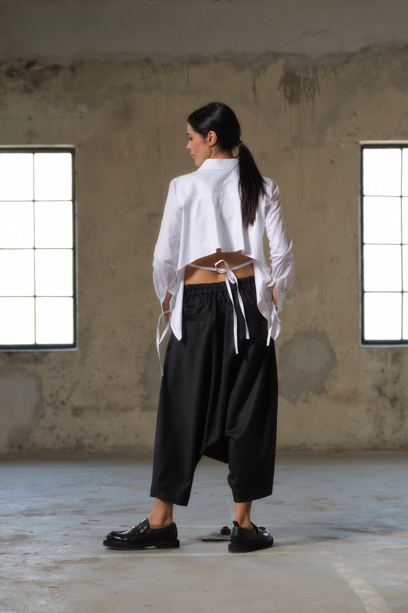 Black wool drop crotch pants with asymmetrical details, Avant-garde  pants Women, Baggy pants, Minimalist urban sustainable clothing