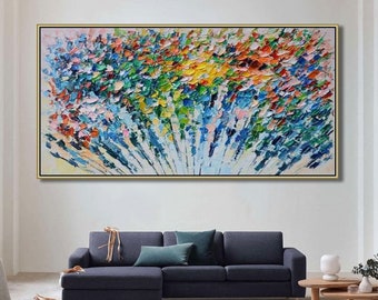 May include: Abstract painting with a colorful, textured, and brushstroke style. The painting features a variety of colors, including blue, green, yellow, orange, and pink. The painting is framed in a gold frame and is hanging on a white wall.
