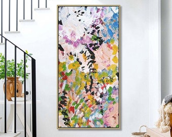 May include: Abstract painting with a colorful, floral design. The painting features a variety of colors, including pink, yellow, green, blue, and black. The painting is framed in a gold frame.
