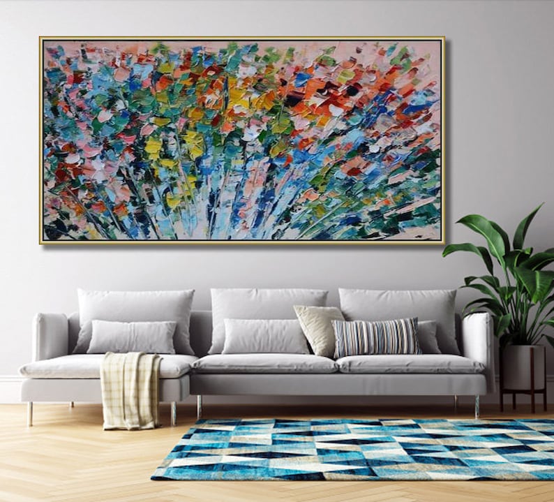 May include: Abstract painting with a colorful, textured, and brushstroke style. The painting features a variety of colors, including blue, green, yellow, orange, and red. The painting is framed in a gold frame and is hanging on a wall.