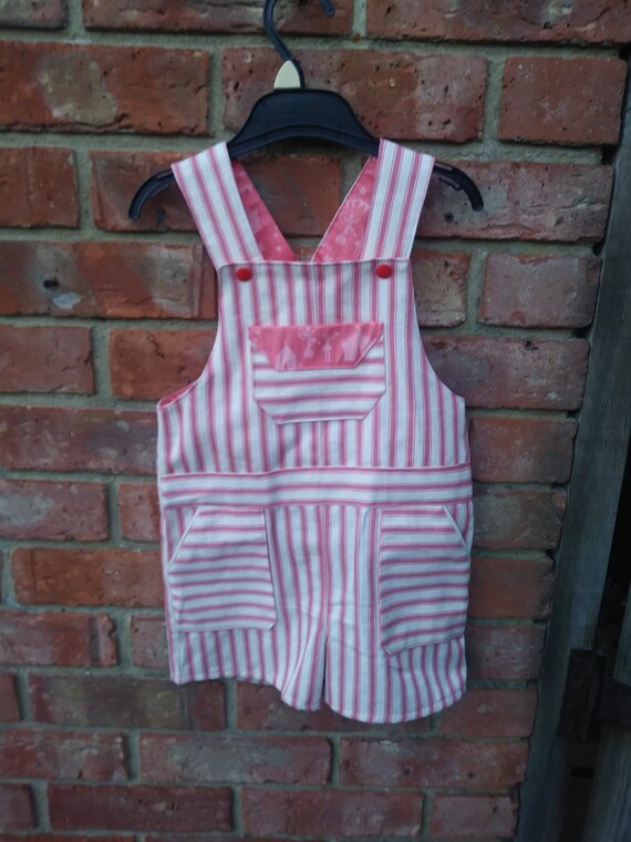 pink short dungarees