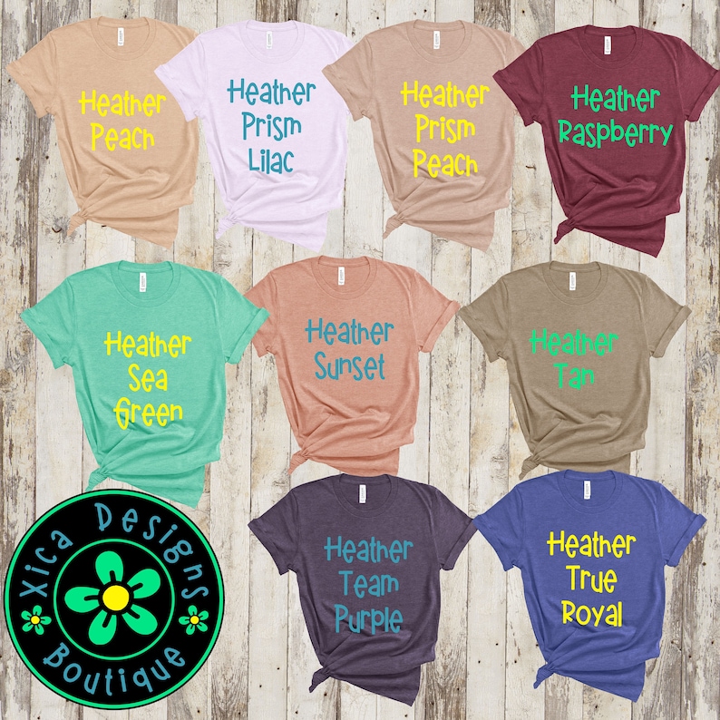 Puede incluir: Una colecci&oacute;n de nueve camisetas jaspeadas en varios colores, incluyendo melocot&oacute;n, lila, frambuesa, verde mar, atardecer, beige, morado equipo y azul real. Cada camiseta presenta la palabra "Heather" seguida del nombre del color.