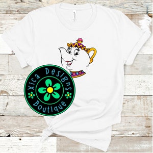May include: White t-shirt featuring a cartoon image of Mrs. Potts from Beauty and the Beast. The t-shirt also has a green circle with a black background and the text "Xica Designs Boutique" in white.