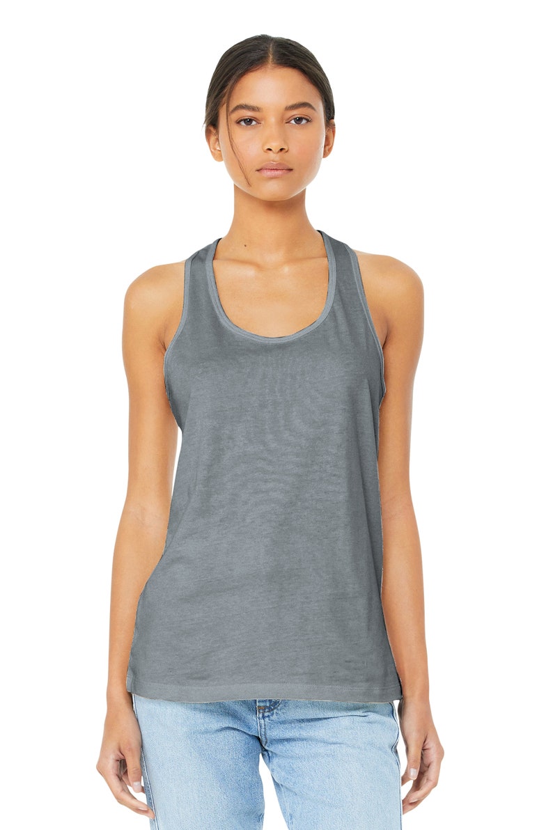 May include: A gray racerback tank top with a scoop neck. The tank top is made of a soft, comfortable fabric and has a relaxed fit.