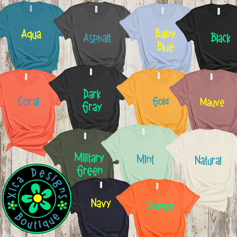 May include: A collection of 12 t-shirts in various colors, each with a different color text design. The colors include aqua, asphalt, baby blue, black, coral, dark gray, gold, mauve, military green, mint, navy, and orange.