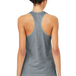 May include: A gray racerback tank top with a relaxed fit. The tank top is made of a soft, comfortable fabric.