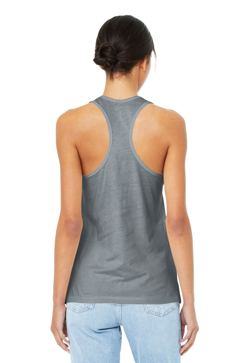 May include: A gray racerback tank top with a relaxed fit. The tank top is made of a soft, comfortable fabric.