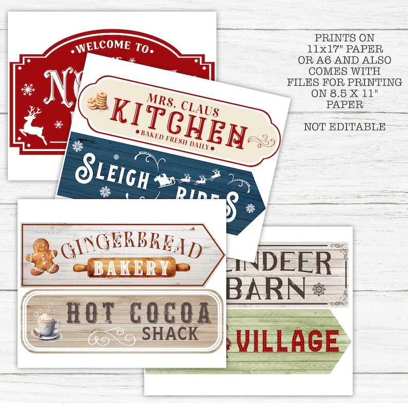 May include: Printable Christmas village signs with a rustic woodgrain background. The signs feature text such as "Gingerbread Bakery", "Hot Cocoa Shack", "Sleigh Rides", "Mrs. Claus Kitchen", "Reindeer Barn", and "Village".