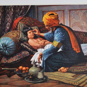 May include: A framed print titled "Rhazes and Arabic Medicine" shows a historical scene. A man in a turban examines a child, surrounded by pillows, fruit, and medical tools. The artwork features rich colours and intricate patterns.