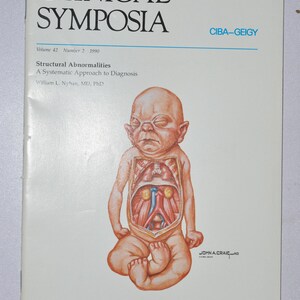 May include: A medical textbook cover titled "Clinical Symposia" with an illustration of a baby with an anatomical view. The text includes "Structural Abnormalities" and "A Systematic Approach to Diagnosis". The publisher is CIBA-GEIGY.