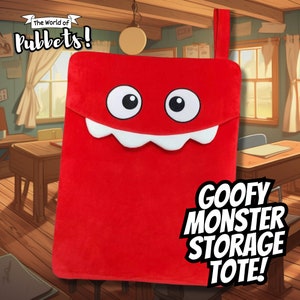 May include: Red plush tote bag with a smiling monster face and the text "GOOFY MONSTER STORAGE TOTE!"