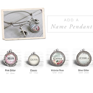 May include: Four silver charm bracelets with different designs. The charms are round and feature different designs, including pink glitter, a classic design, a Victorian rose design, and silver glitter. The charms are 3/4 inch (20 mm), 5/8 inch (17 mm), 13/16 inch (21 mm), and 13/16 inch (21 mm) in diameter.