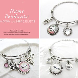 May include: Four silver bangle bracelets with charms and personalized name pendants. The pendants feature the words "MIJA", "CANDY", "EMBRACE", and "LOVE".