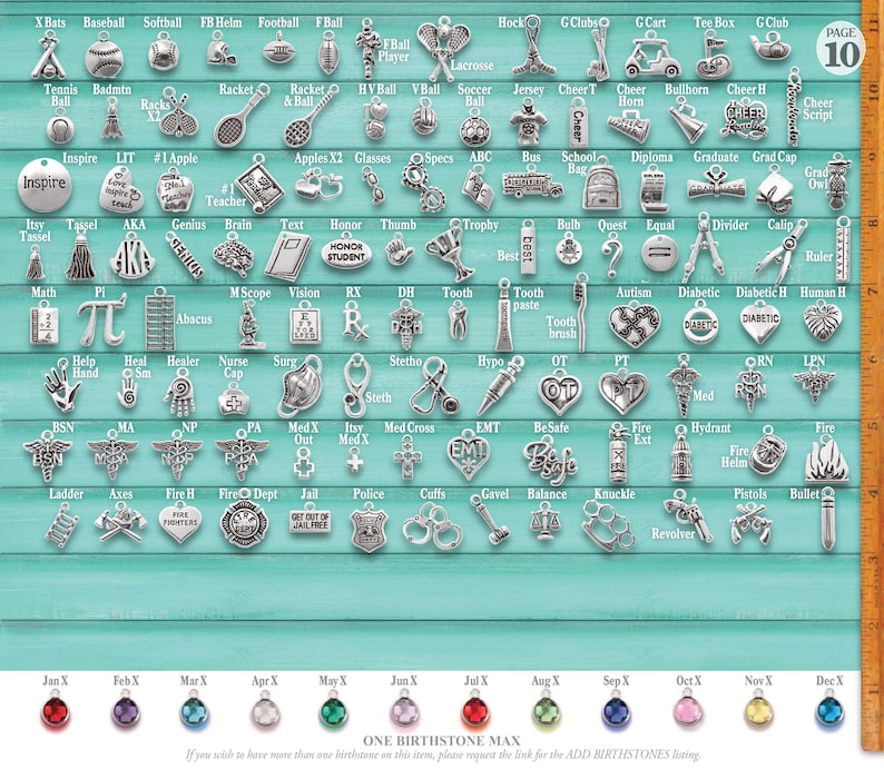 May include: A collection of silver-toned metal charms arranged in rows on a teal background, featuring sports, school, medical, and emergency themes, with a vertical 10-inch ruler on the right and twelve colored birthstone charms at the bottom.