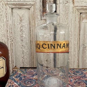 Antique French Cinnamon Water apothecary bottle with label and glass stopper