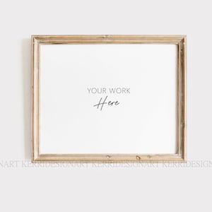 Peut inclure: Un cadre photo en bois clair avec un passe-partout blanc et le texte "YOUR WORK Here" en noir.