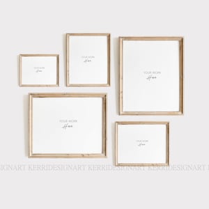 May include: Four wooden picture frames with a white background. The frames are arranged in a staggered pattern. The text "YOUR WORK HERE" is written in black cursive inside each frame.