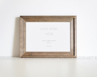 May include: A brown wooden frame with a white mount and the text "YOUR WORK HERE" in the centre. The text below reads "PSD FILE WITH SMART OBJECT. JPG FILE."