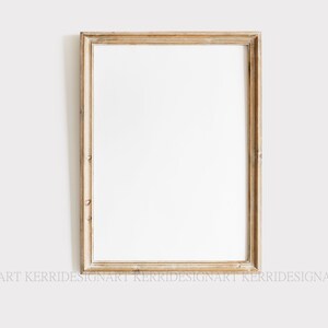 May include: A simple, light wood picture frame with a white mat and a white background. The frame is rectangular and has a slightly distressed finish.