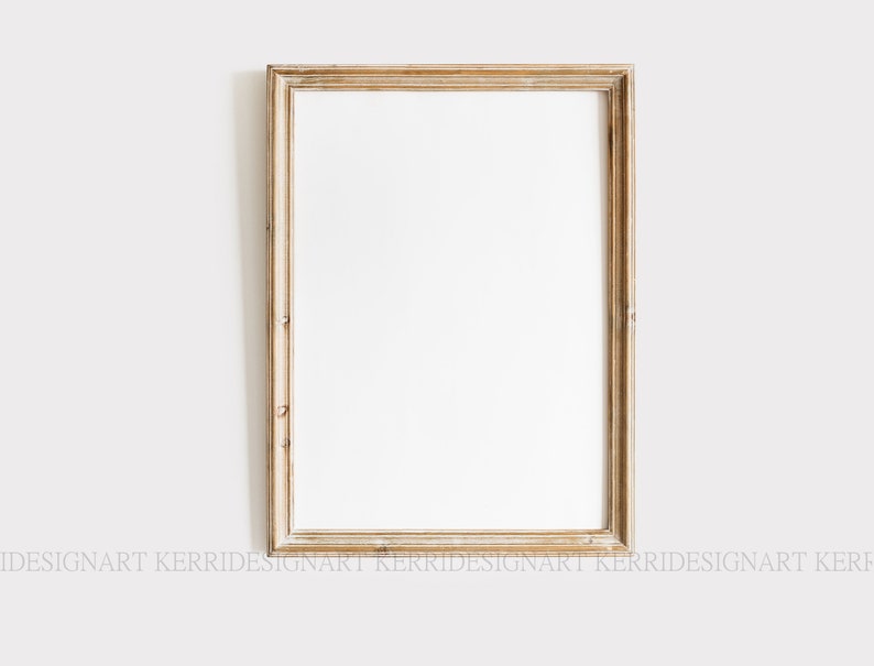 May include: A simple, light wood picture frame with a white mat and a white background. The frame is rectangular and has a slightly distressed finish.