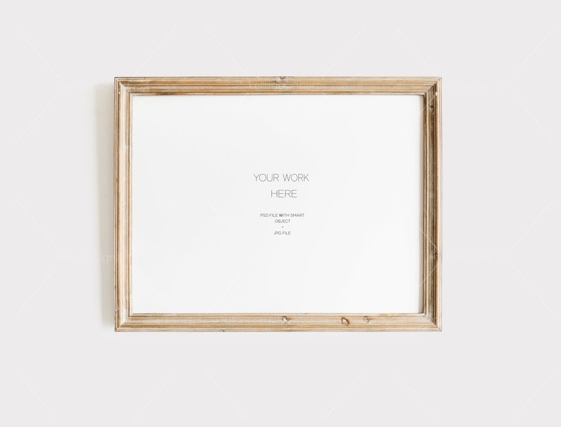 May include: A rectangular, light-colored wooden picture frame with a white interior. The frame has a distressed, vintage look. Text on the white interior reads "YOUR WORK HERE" and other smaller text below. The frame is set against a plain white background.