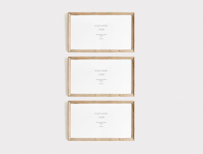 Op de afbeelding: Drie rechthoekige houten fotolijsten met witte passe-partouts en de tekst "YOUR WORK HERE". De lijsten zijn verticaal geplaatst tegen een witte achtergrond, ideaal voor het presenteren van kunstwerken of foto's.