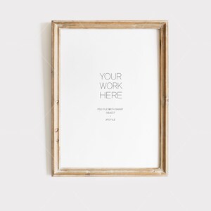 May include: A light wood picture frame with a white mat and a white background. The text "YOUR WORK HERE" is printed in the center of the mat. The text "PSD FILE WITH SMART OBJECT" and "JPG FILE" are printed below the text "YOUR WORK HERE".