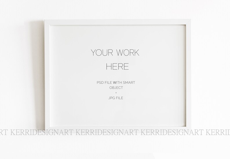 May include: White picture frame mockup with the text "YOUR WORK HERE" and "PSD FILE WITH SMART OBJECT JPG FILE" inside the frame.