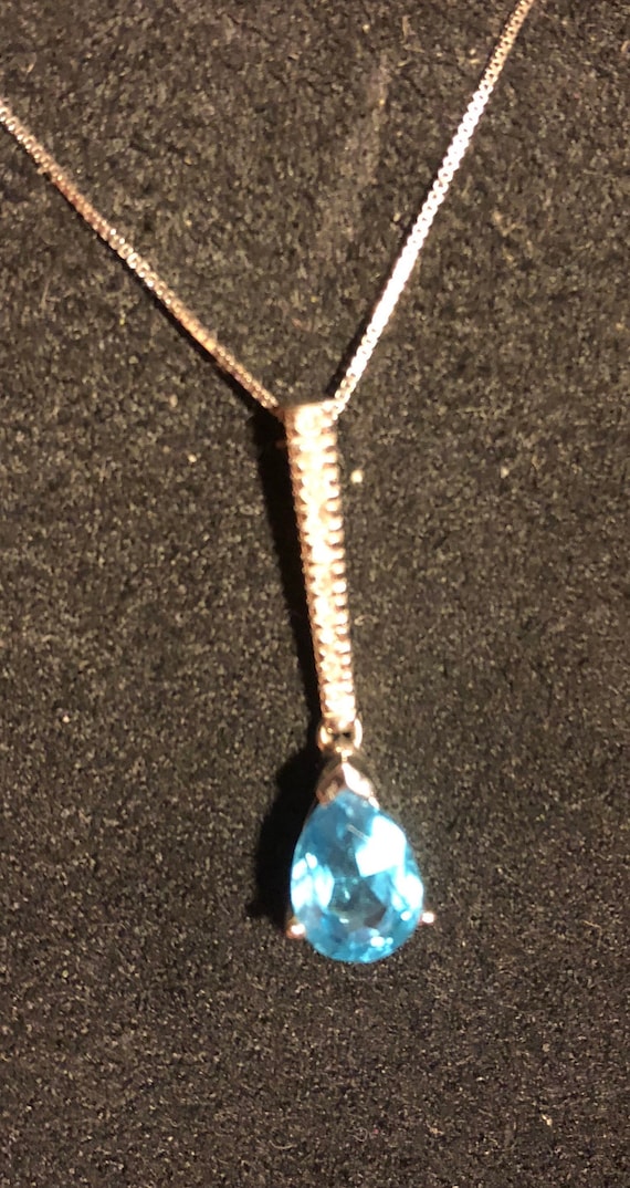 Pave diamonds with a TearDrop Blue Topaz pendant, 